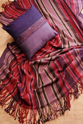 Ten Thousand Villages offers many home furnishings made from sustainably crafted textiles, including this handwoven silk and cotton pillow made by Laotian artisans and this soft, gorgeous alpaca wool throw woven in Bolivia.